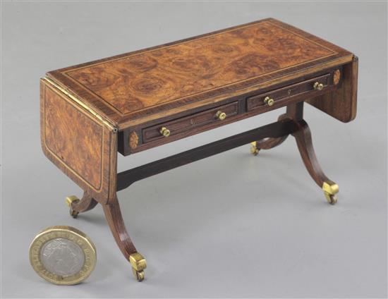 Denis Hillman. A Regency style banded burr walnut and rosewood banded miniature sofa table, width 4 1/8ins. (flaps down)